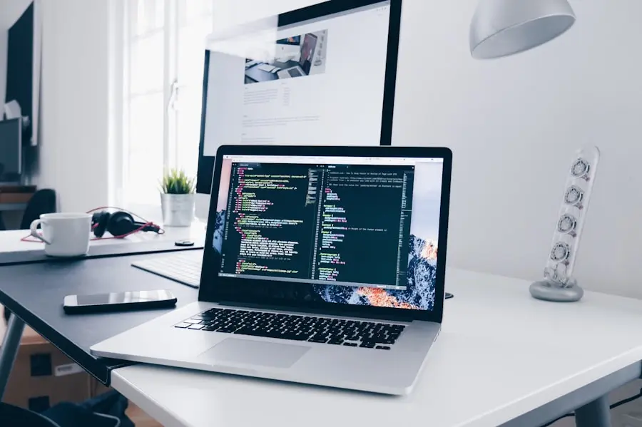 Remote developer working on laptop with multiple monitors showing cloud dashboards and code